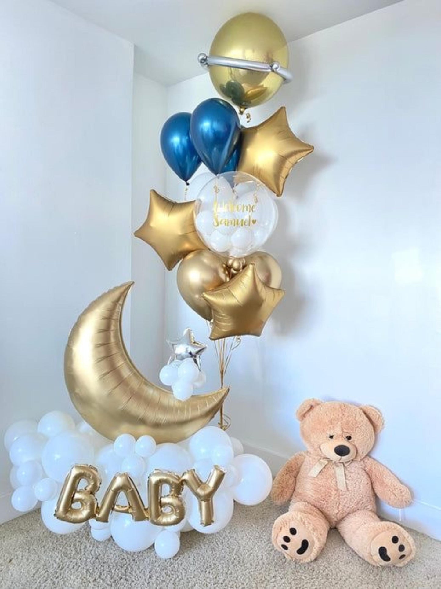 Gold balloon decoration with teddy bear 